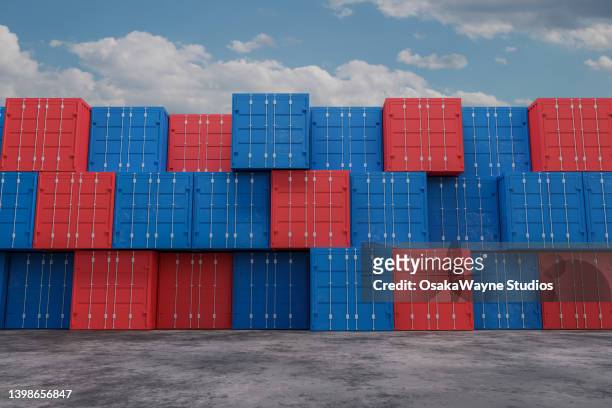 stacked colour containers against sky with clouds - skybox stockfoto's en -beelden