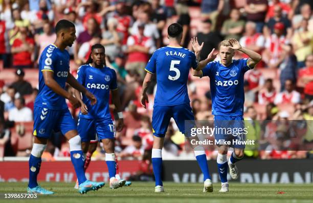 Donny van de Beek of Everton celebrates with teammates after scoring their team's first goal during the Premier League match between Arsenal and...