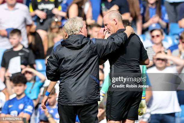 Watford's assistant manager Ray Lewington has a friendly chat with Referee Mike Dean as the teams walk off for half-time during the Premier League...