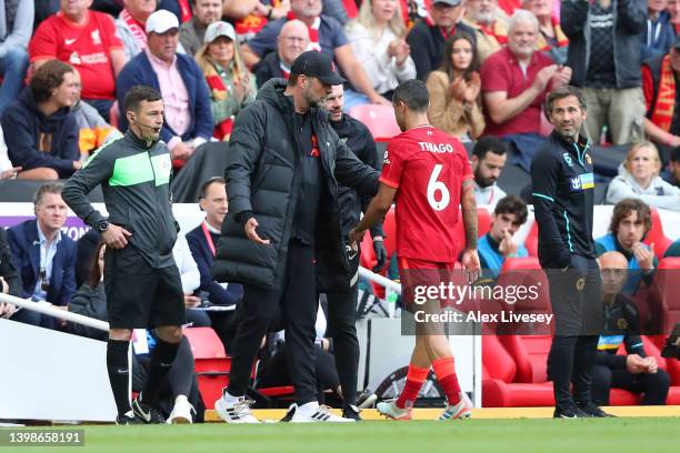 Jurgen Klopp, Manager of Liverpool interacts with Thiago Alcantara of Liverpool during the Premier League match between Liverpool and Wolverhampton...