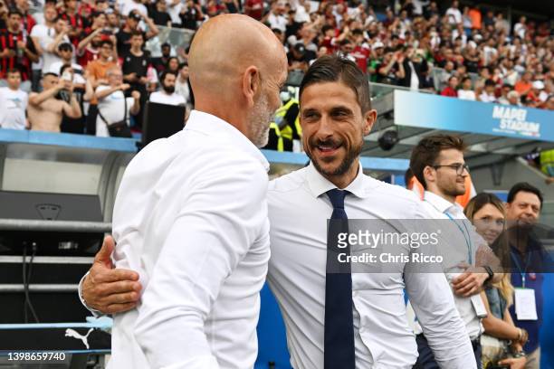 Alessio Dionisi, Head Coach of US Sassuolo embraces Stefano Pioli, Head Coach of AC Milan prior to the Serie A match between US Sassuolo and AC Milan...
