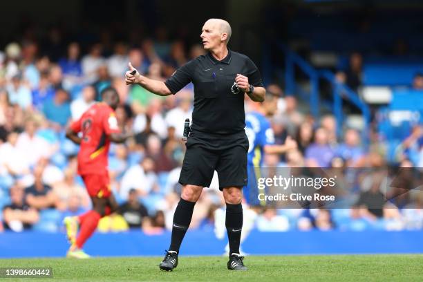 Match referee Mike Dean reacts during the Premier League match between Chelsea and Watford at Stamford Bridge on May 22, 2022 in London, England.