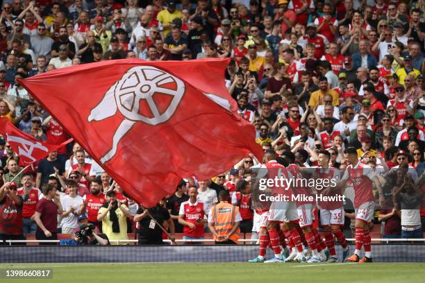 Cedric Soares of Arsenal celebrates with teammates after scoring their team's third goal during the Premier League match between Arsenal and Everton...