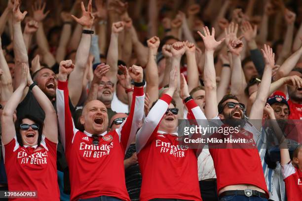 Arsenal fans celebrate their sides fourth goal by Gabriel Magalhaes of Arsenal during the Premier League match between Arsenal and Everton at...