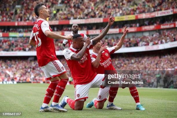 Gabriel Magalhaes of Arsenal celebrates with teammates after scoring their team's fourth goal during the Premier League match between Arsenal and...