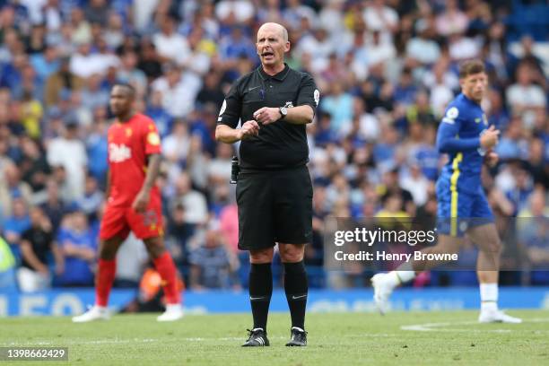 Match referee Mike Dean reacts during the Premier League match between Chelsea and Watford at Stamford Bridge on May 22, 2022 in London, England.
