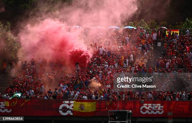 Carlos Sainz of Spain and Ferrari fans light red flares to show their support during the F1 Grand Prix of Spain at Circuit de Barcelona-Catalunya on...
