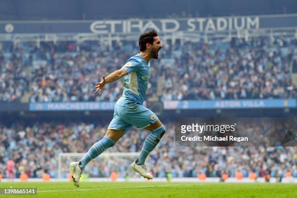 Ilkay Guendogan of Manchester City celebrates after scoring their team's third goal during the Premier League match between Manchester City and Aston...