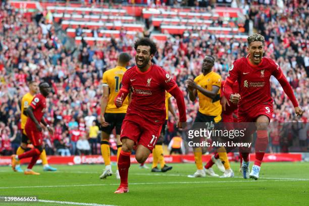Mohamed Salah of Liverpool celebrates after scoring their sides second goal during the Premier League match between Liverpool and Wolverhampton...