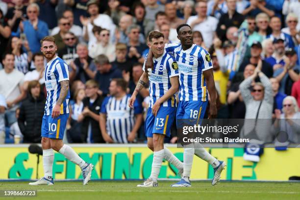 Danny Welbeck of Brighton & Hove Albion celebrates with teammate Pascal Gross after scoring their side's third goal during the Premier League match...