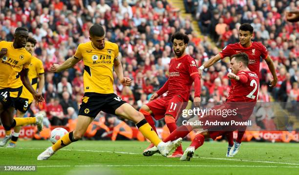 Andy Robertson of Liverpool scoring the third goal making the score 3-1 during the Premier League match between Liverpool and Wolverhampton Wanderers...