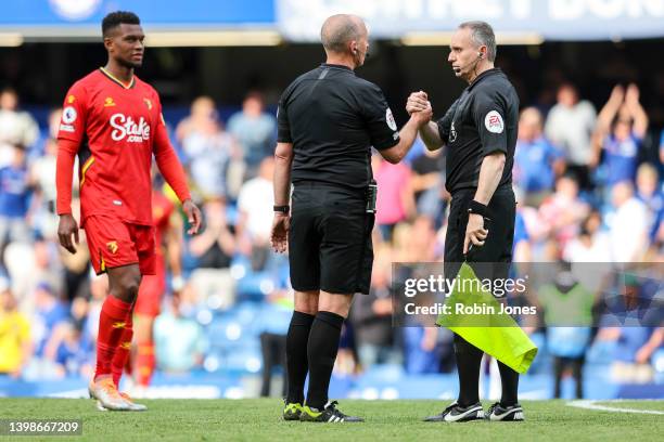 Referee Mike Dean, officiating his last game, after the Premier League match between Chelsea and Watford at Stamford Bridge on May 22, 2022 in...