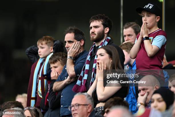 Burnley fans looks dejected following defeat and relegation to the Sky Bet Championship following the Premier League match between Burnley and...