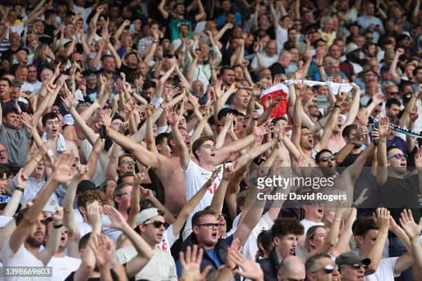Tottenham Hotspur fans celebrate during the Premier League match between Norwich City and Tottenham Hotspur at Carrow Road on May 22, 2022 in...