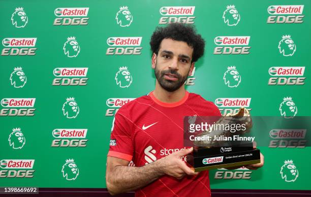 Mohamed Salah of Liverpool poses with the Castrol Golden Boot award after the Premier League match between Liverpool and Wolverhampton Wanderers at...