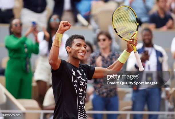 Felix Auger-Aliassime of Canada celebrates his win over against Juan Pablo Varillas of Peru in their first round match during the 2022 French Open at...