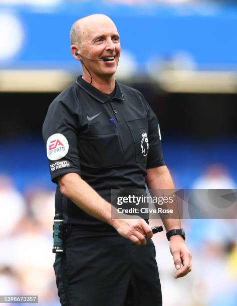 Referee, Mike Dean reacts during the Premier League match between Chelsea and Watford at Stamford Bridge on May 22, 2022 in London, England.