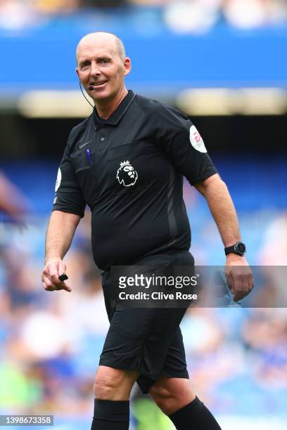 Referee, Mike Dean reacts during the Premier League match between Chelsea and Watford at Stamford Bridge on May 22, 2022 in London, England.