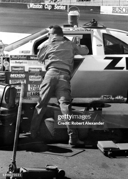 Driver Alan Kulwicki works on his racecar prior to the start of the 1990 Busch 500 stock car race at Bristol International Speedway in Bristol,...