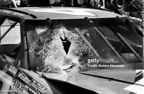 Driver Kyle Petty's racecar with a windshield damaged by a piece of debris which hit the car during the running of the 1990 Busch 500 stock car race...