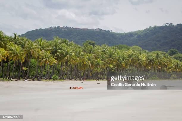 people enjoying the beach - playa carrillo stock pictures, royalty-free photos & images
