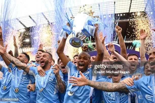 Fernandinho of Manchester City lifts the Premier League trophy after their side finished the season as Premier League champions during the Premier...