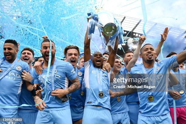 Fernandinho of Manchester City lifts the Premier League trophy after their side finished the season as Premier League champions during the Premier...