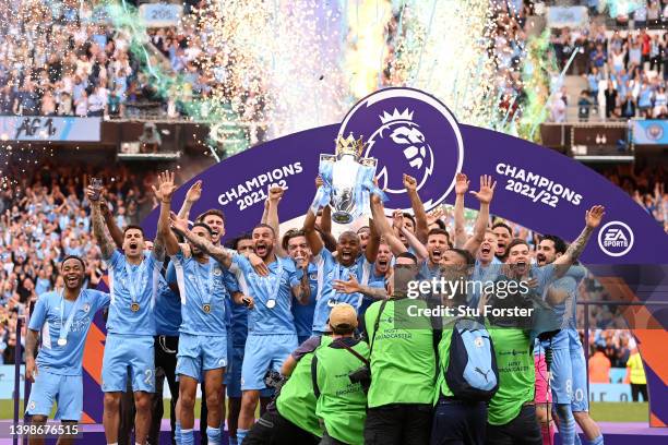 Fernandinho of Manchester City lifts the Premier League trophy after their side finished the season as Premier League champions during the Premier...