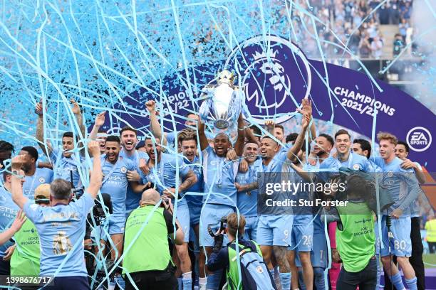 Fernandinho of Manchester City lifts the Premier League trophy after their side finished the season as Premier League champions during the Premier...