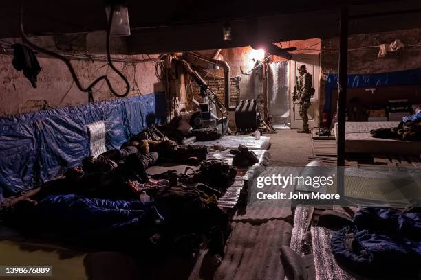 Ukrainian Territorial Defense soldiers rest at their frontline encampment on May 22, 2022 near Ruska Lozova, Ukraine. Russian forces had occupied...