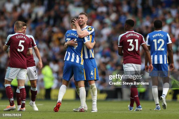 Adam Webster and Joel Veltman of Brighton & Hove Albion celebrate at the final whistle during the Premier League match between Brighton & Hove Albion...