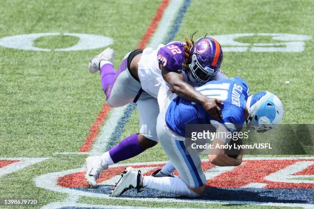 Kyle Sloter of the New Orleans Breakers is sacked by Jeremiah Pharms Jr. #92 of the Pittsburgh Maulers in the second quarter of the game at...