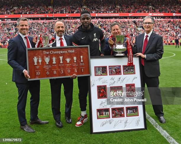 Divock Origi of Liverpool receives gifts from Billy Hogan CEO of Liverpool Football Club Fenway Sports Group president Mike Gordon, Fenway Sports...