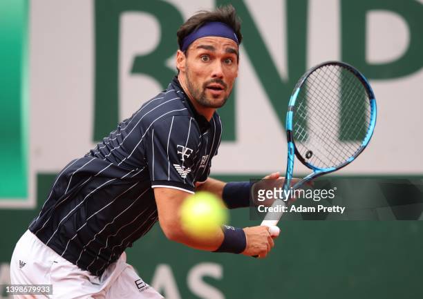 Fabio Fognini of Italy plays a backhand during his mens singles first round match against Alexei Popyrin of Australia on day 1 of the 2022 French...
