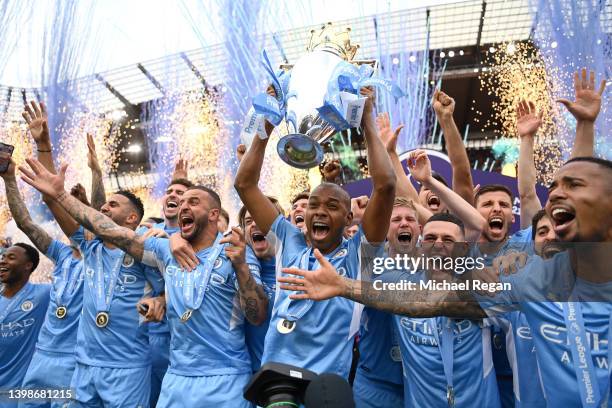 Fernandinho of Manchester City lifts the Premier League trophy after their side finished the season as Premier League champions during the Premier...