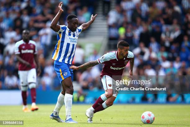 Manuel Lanzini of West Ham holds off Brighton's Danny Welbeck during the Premier League match between Brighton & Hove Albion and West Ham United at...