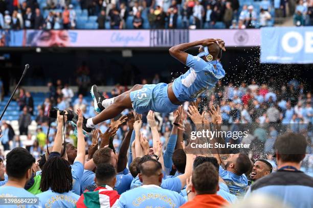 Fernandinho of Manchester City is lifted in the air by teammates after their last game for Manchester City as their side finished the season as...