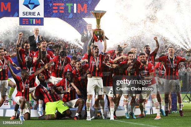 Alessio Romagnoli of AC Milan lifts the Serie A Scudetto trophy after their side finished the season as Serie A champions during the Serie A match...