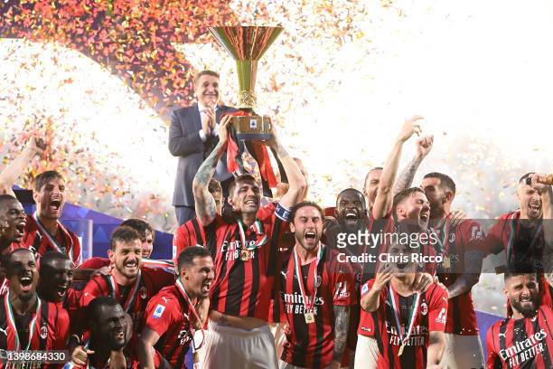 Alessio Romagnoli of AC Milan lifts the Serie A Scudetto trophy after their side finished the season as Serie A champions during the Serie A match...