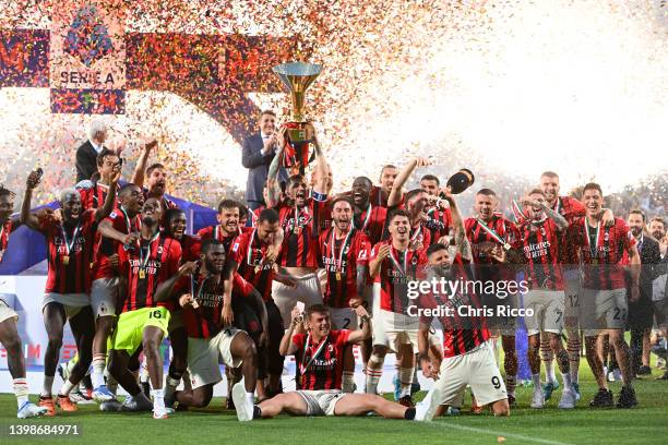 Alessio Romagnoli of AC Milan lifts the Serie A Scudetto trophy after their side finished the season as Serie A champions during the Serie A match...