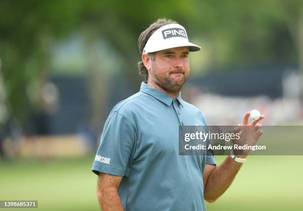 Bubba Watson of the United States reacts to his putt on the third green during the final round of the 2022 PGA Championship at Southern Hills Country...