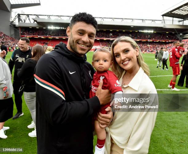 Alex Oxlade-Chamberlain of Liverpool posing for a photograph with Perrie Edwards and their baby boy at the end of the Premier League match between...