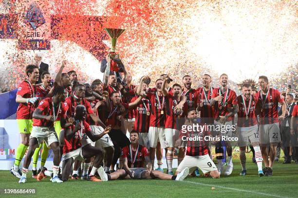 Alessio Romagnoli of AC Milan lifts the Serie A Scudetto trophy after their side finished the season as Serie A champions during the Serie A match...