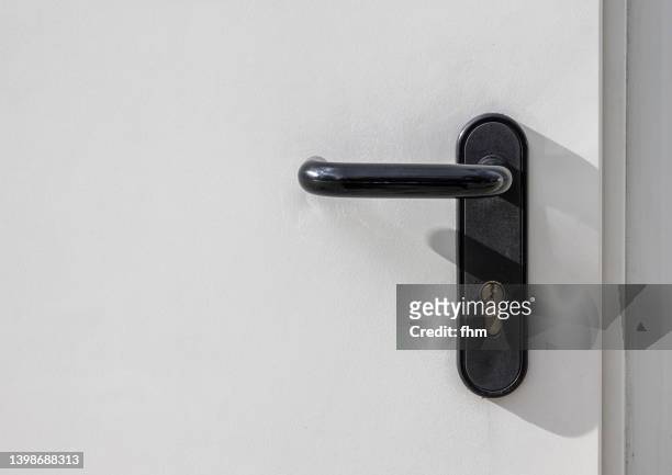 white door and doorknob - key hole stock pictures, royalty-free photos & images