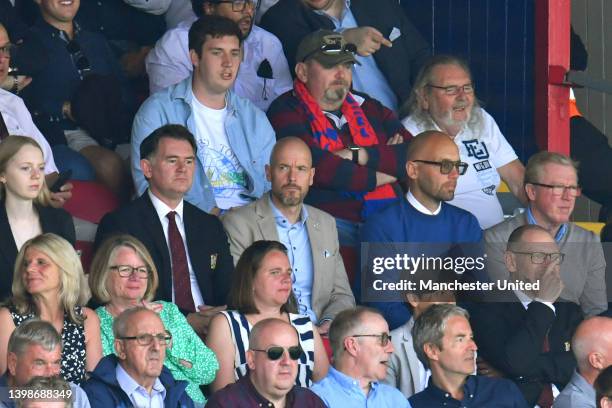 Incoming manager Eric ten Hag, Mitchell van der Gaag and Steve McClaren of Manchester United watches from the directors' box ahead of the Premier...