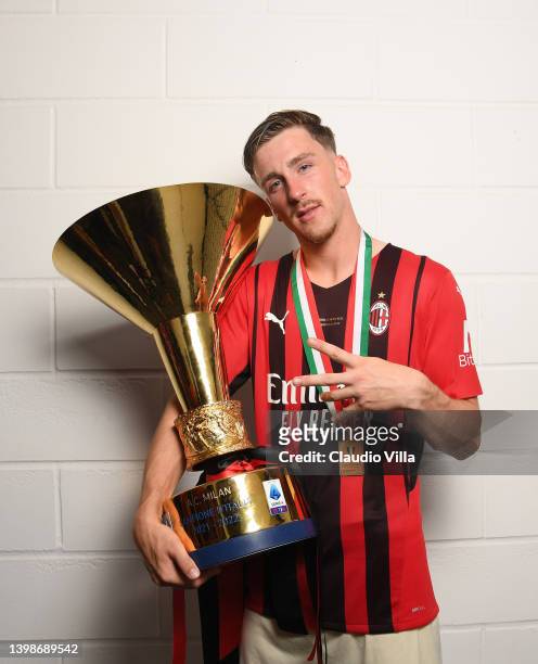 Alexis Saelemaekers of AC Milan poses with the trophy for the victory of "scudetto " at the end of the last Serie A match between US Sassuolo and AC...