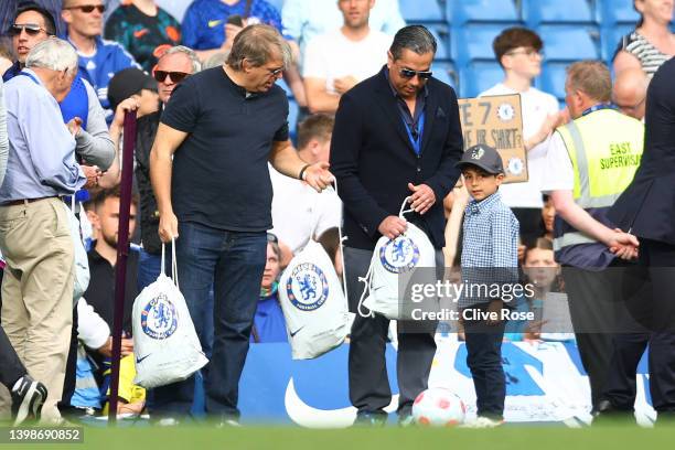 Chelsea's prospective US owner Todd Boehly looks on holding a Chelsea bag as the Chelsea team complete a lap of honor after the Premier League match...