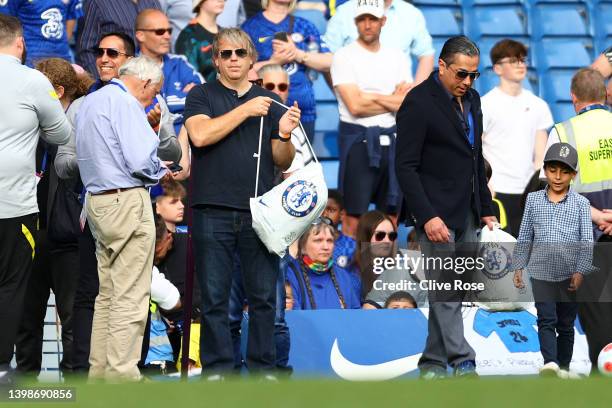 Chelsea's prospective US owner Todd Boehly looks on holding a Chelsea bag as the Chelsea team complete a lap of honor after the Premier League match...