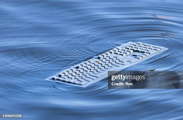 computer keyboard on the water - emergency department stock pictures, royalty-free photos & images