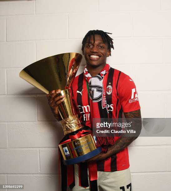 Rafael Leao of AC Milan poses with the trophy for the victory of "scudetto " at the end of the last Serie A match between US Sassuolo and AC Milan at...